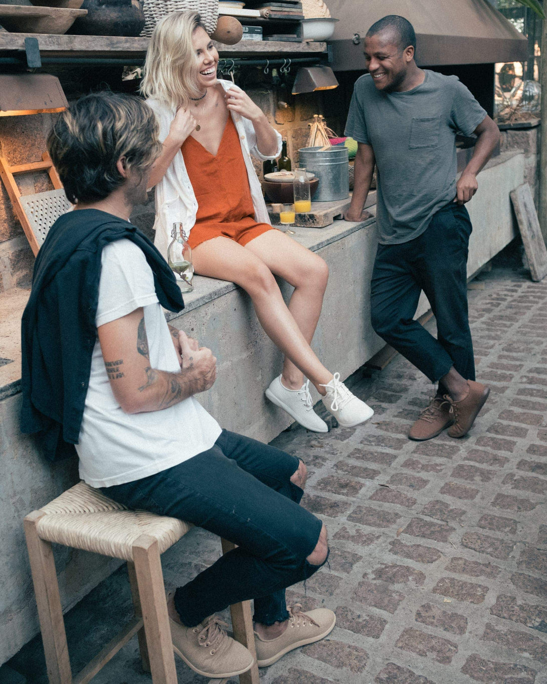 Group of smiling friends wearing yuool merino wool shoes